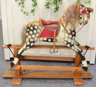 Lot 1377 - ^ A wooden painted rocking horse