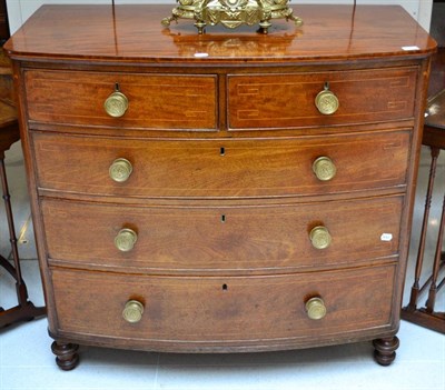 Lot 1379 - A George IV mahogany and box wood strung bow fronted chest of drawers