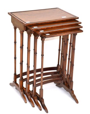 Lot 1380 - A late Victorian mahogany nest of four tables, with rosewood and ebony stringing