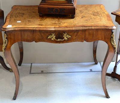 Lot 1381 - A Victorian walnut and marquetry writing table in the Louis XV style