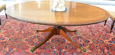 Lot 1403 - A George III mahogany oval dining table