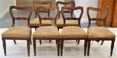 Lot 1404 - A set of six George IV mahogany dining chairs, raised on turned and reeded fore legs