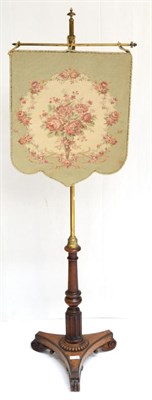 Lot 1406 - A George IV mahogany pole screen with floral needlework banner