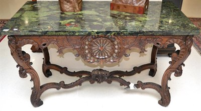 Lot 1407 - * A 19th century Regence oak console table, raised on acanthus carved scroll supports, joined...