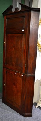 Lot 1413 - A George III Cuban mahogany corner cupboard