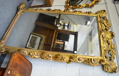 Lot 1428 - + A 19th century giltwood and gesso overmantel mirror raised on later bun feet, height 225cm