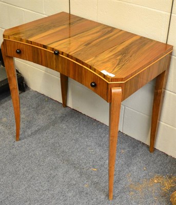 Lot 1429 - * A walnut dressing table of bow fronted form with hinged lid enclosing a mirror