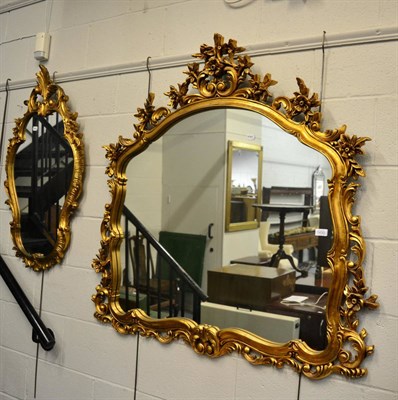 Lot 1430 - A reproduction gilt over mantel mirror and a reproduction gilt cartouche shaped mirror