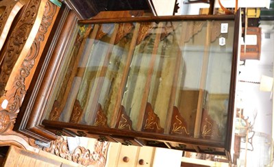 Lot 1435 - A cigarette dispenser glass fronted mahogany table top display cabinet, with seven drawers to...