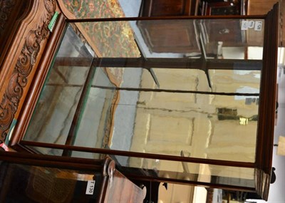 Lot 1437 - A Victorian mahogany table top display cabinet with glass front and sides, and two adjustable...