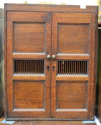 Lot 1447 - An oak food cupboard