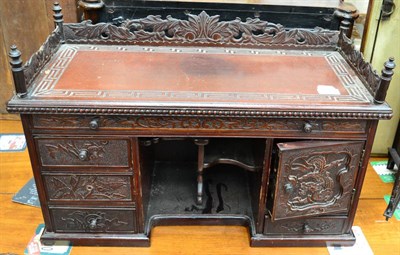 Lot 1449 - An early 20th century Chinese carved wood table cabinet