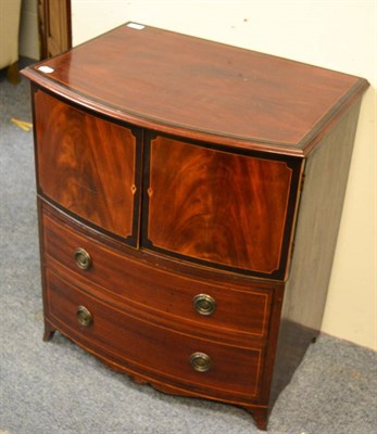 Lot 1453 - A small chest of drawers in the form of a commode cupboard