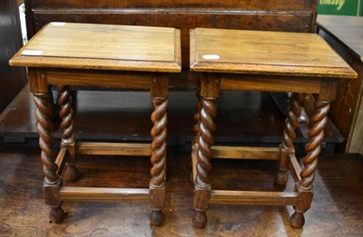 Lot 1462 - A pair of hardwood side tables/stools with barley twist supports