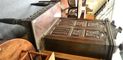 Lot 1463 - + An 18th century carved oak double door cabinet with fluted stiles, raised on a later table...