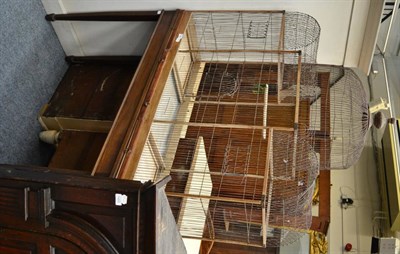 Lot 1466 - A wire bird cage on later mahogany base, 120cm wide