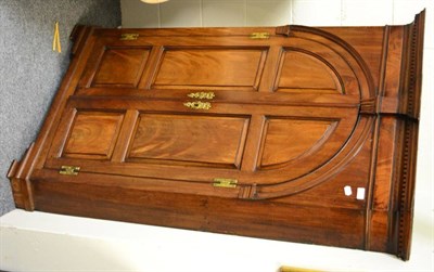 Lot 1470 - A mahogany corner cupboard with double arched doors and shaped shelves