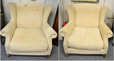 Lot 1471 - A pair of large wing back armchairs