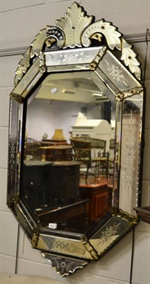 Lot 1472 - ~ A Venetian bevelled glass mirror with floral etched decoration, height 126cm