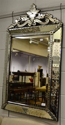 Lot 1473 - ~ A Venetian bevelled glass mirror with floral etched decoration, height 120cm