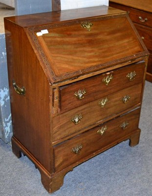 Lot 1484 - A late George III carved mahogany bureau, 83cm wide