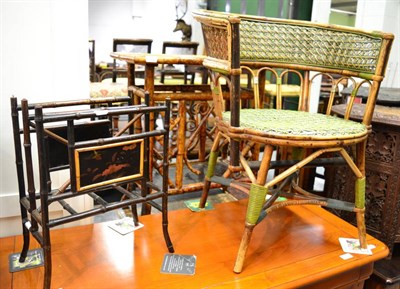 Lot 1493 - A bamboo occasional table, bamboo magazine rack and bamboo small open armchair