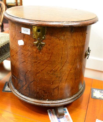 Lot 1494 - An 18th century oak cylinder shaped pot cupboard