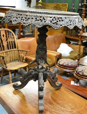 Lot 1499 - A 19th century carved Burmese tilt-top tripod table