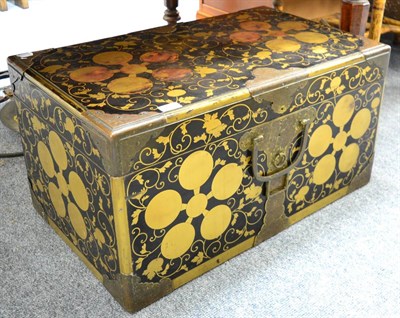 Lot 1513 - A lacquered and brass bound trunk of Oriental origin