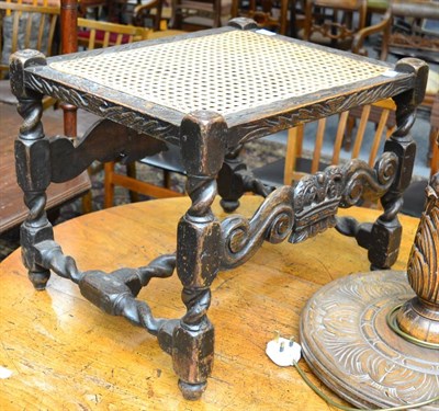 Lot 1523 - A 17th century carved oak stool with later cane seat