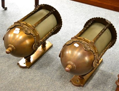 Lot 1529 - A pair of bronzed wall lights with opaque glass panels