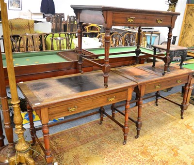 Lot 1540 - ~ Three late Victorian Shoolbred & Co. writing tables with worn leather tops, stamped and...