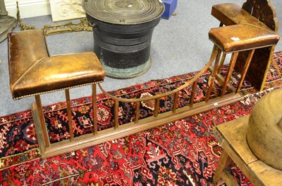 Lot 1542 - ^ A 19th century copper club fender with brown leather close nailed seat, 157cm wide