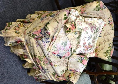 Lot 1561 - A small wingback chair with floral loose cover