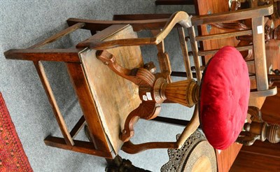 Lot 1582 - # An early 19th century oak armchair, together with a walnut revolving music seat