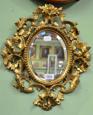 Lot 1606 - A 19th century gilt Florentine style mirror, height 44cm