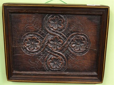 Lot 1607 - A late 17th century/early 18th century oak panel carved with flower heads, later framed, 40cm...