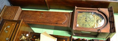 Lot 1610 - An oak eight day longcase clock, flat top pediment, inlaid borders, arched brass dial with a...