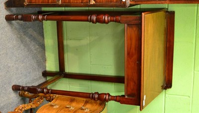 Lot 1615 - ~ A late Victorian walnut clerk's desk with hinged lid, stamped James Shoolbred & Co. and...