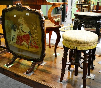 Lot 1624 - A late Victorian adjustable music seat on turned legs and a late Victorian rosewood fire screen