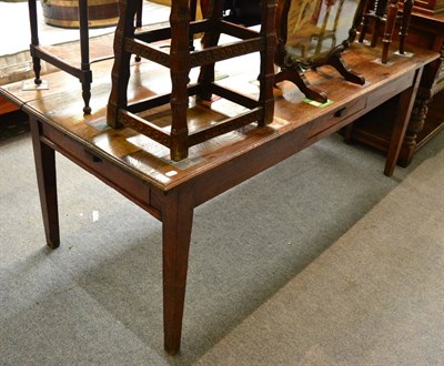 Lot 1626 - A 19th century oak plank top farmhouse table, fitted with two drawers