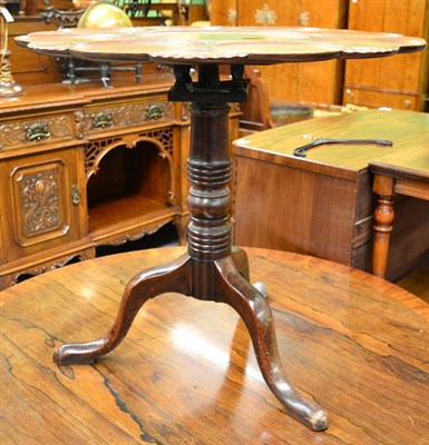 Lot 1645 - A George III mahogany flip top table raised on bird cage platform