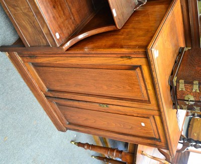 Lot 1697 - ~ A late Victorian walnut double door cabinet enclosing three pine shelves