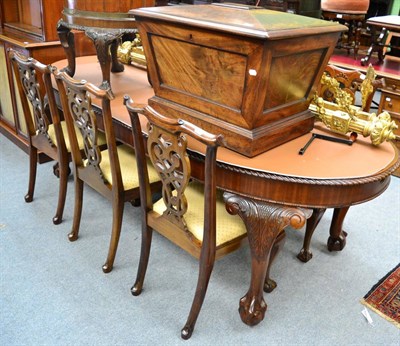 Lot 1700 - A set of six dining chairs circa 1900, together with an extending dining table on ball and claw...