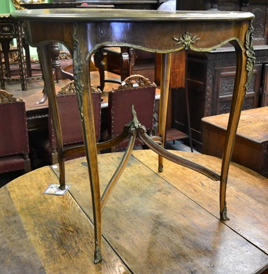 Lot 1703 - A rosewood and inlaid occasional table, in the Louis XV style, the circular top with a moulded...