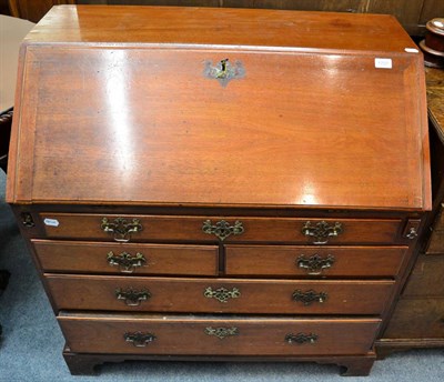 Lot 1707 - ~ A George III mahogany bureau