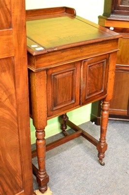 Lot 1731 - ~ A late Victorian walnut clerk's desk with hinged lid