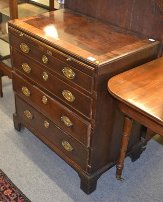 Lot 1741 - A George III straight fronted chest of drawers with brushing slide