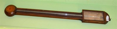 Lot 1754 - *A mahogany stick barometer, early 19th century, arched top, inlaid cistern cover and stringing...