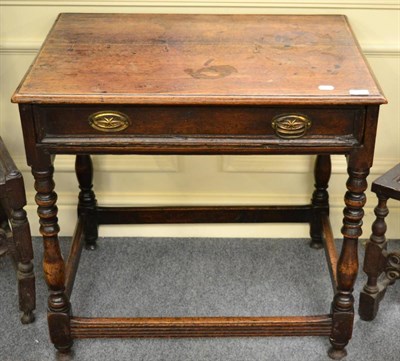 Lot 1755 - ~ An early 18th century oak side table on turned spindle legs